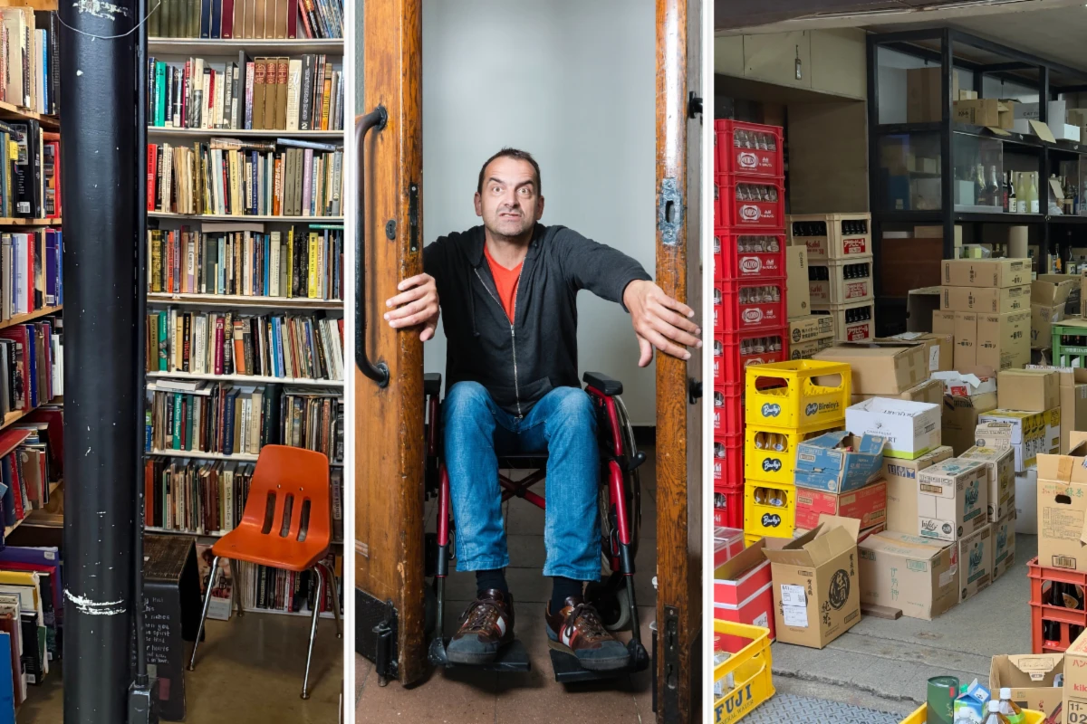 Man in wheelchair demonstrating that a supply closet door is not wide enough for him to enter.